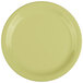 A close-up of a yellow GET Avocado Diamond Harvest plate with white rolled edges.