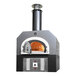 A silver and black Chicago Brick Oven countertop pizza oven with a pizza inside.