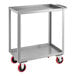 A silver steel Lavex utility cart with red wheels.