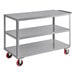 A gray Lavex three shelf steel utility cart with wheels.