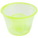 A yellow plastic cup with a small hole in the bottom.