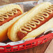 A hot dog with Woeber's horseradish mustard on it in a basket.