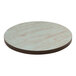 An American Tables & Seating round laminate table top with a blue wood grain finish.