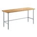 A Regency wood top work table with metal legs.