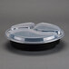 A black Pactiv plastic container with three compartments and a clear lid.