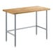 A Regency wood top work table with galvanized metal legs.
