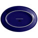A cobalt blue oval china platter with a silver rim.