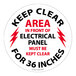 A round red and black vinyl floor sign that says "Electrical Panel Keep Clear for 36 Inches"