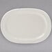 A white Tuxton china platter with an embossed rim.