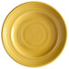 A yellow Tuxton Concentrix china plate with a white spiral pattern.
