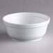 A white styrofoam bowl with a lid.