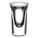 A close-up of a Libbey tall shot glass with a clear rim.