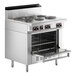 A stainless steel Garland restaurant range with six sealed burners and a standard oven.