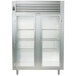 A Traulsen two section glass door refrigerator with stainless steel and black accents.