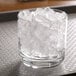 A glass of Hoshizaki cubelet ice on a counter.
