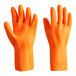 A pair of small orange neoprene and latex gloves with a flock lining.