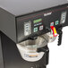 A Bunn BrewWISE dual automatic coffee brewer with a pot on it.