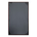 A rectangular black leather menu cover with picture corners.