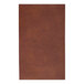 A close-up of a brown rectangular H. Risch, Inc. Tuxedo leather menu cover.