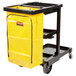 A Rubbermaid janitor cart with a yellow bag.