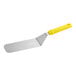 A Choice spatula with a yellow handle.
