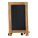 A Flash Furniture wooden tabletop chalkboard with metal scrolled legs.