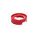 A red plastic ring with a hole on a white background.
