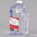 A clear plastic jug of Sterno Soft Light liquid wax with a red label.