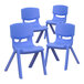 A set of three blue plastic Flash Furniture Whitney stackable chairs with legs.