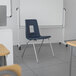 A navy blue Flash Furniture Mickey Advantage classroom chair with a square cut out on metal legs.