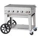 A Crown Verity natural gas grill on a cart with wheels.
