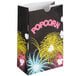 A black Bagcraft popcorn bag with a colorful Funburst design of fireworks.