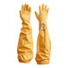 A yellow bag with a white background containing a pair of yellow Showa nitrile gloves with a yellow knit lining and a rough grip.
