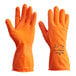 A close-up of a pair of orange Showa 707HVO dishwashing gloves with an orange wrist.