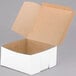 A white customizable cake box with a lid open.