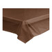A brown plastic tablecloth on a table.