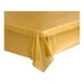 A metallic gold plastic table cover on a table.