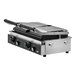 A Vollrath double cast iron panini grill with smooth plates on a counter.