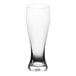 An Acopa Pilsner glass with clear liquid in it.