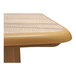 The beige sawcut square table top of a Grosfillex Aquaba table.
