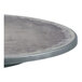 A Grosfillex round zinc resin table with charcoal legs.