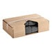 A cardboard box with a black plastic bag inside.