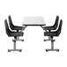 A National Public Seating white board cluster table with black edge banding and black swivel chairs.