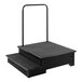 A black rectangular step with a metal handle.