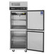 A Turbo Air M3 Series reach-in freezer with two open half doors.