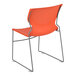 An orange Flash Furniture Hercules chair with a gray metal frame.