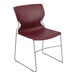A burgundy Flash Furniture stacking chair with a metal frame.