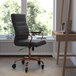 A Flash Furniture Whitney black leather office chair with rose gold legs.