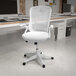 A Flash Furniture white mesh high-back office chair in an office.