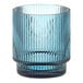 An Acopa Lore blue glass tealight holder with a ribbed design.